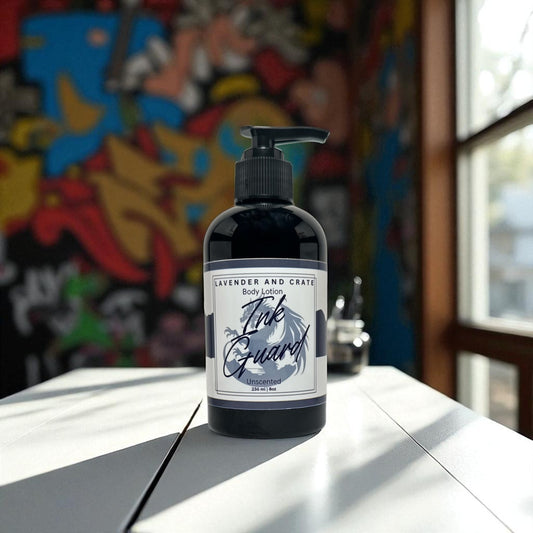Body lotion bottle labeled 'Ink Guard' on a table with a colorful mural in the background